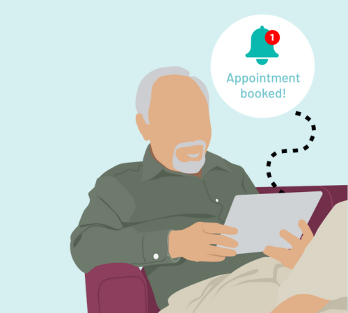 A person sitting in a chair, booking a dental appointment online